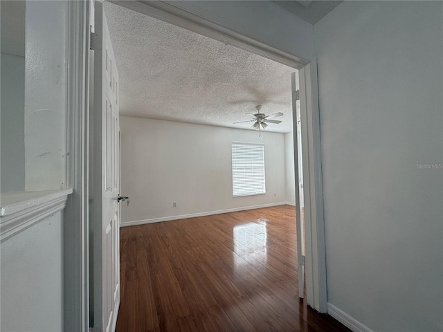 unfurnished room featuring ceiling fan, a textured ceiling, and hardwood / wood-style flooring