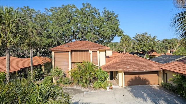 mediterranean / spanish-style house featuring a garage