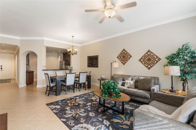 living room with ceiling fan with notable chandelier, light tile patterned floors, and crown molding