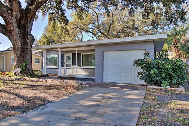 ranch-style house featuring a garage and a porch