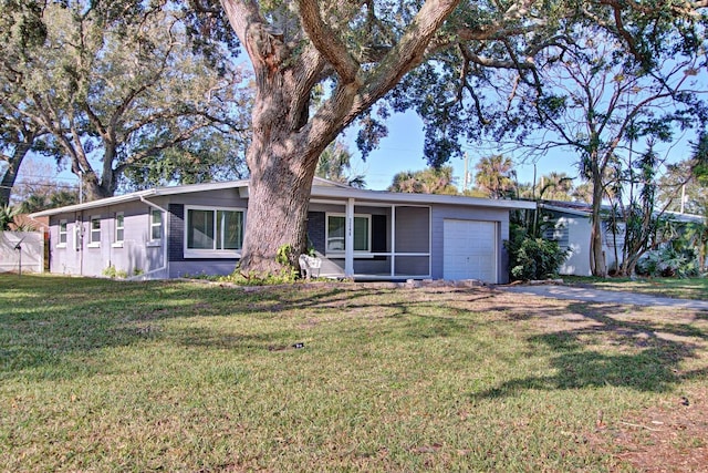 ranch-style home featuring a front yard and a garage