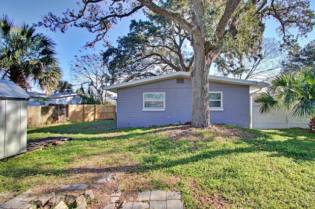 view of home's exterior with a yard