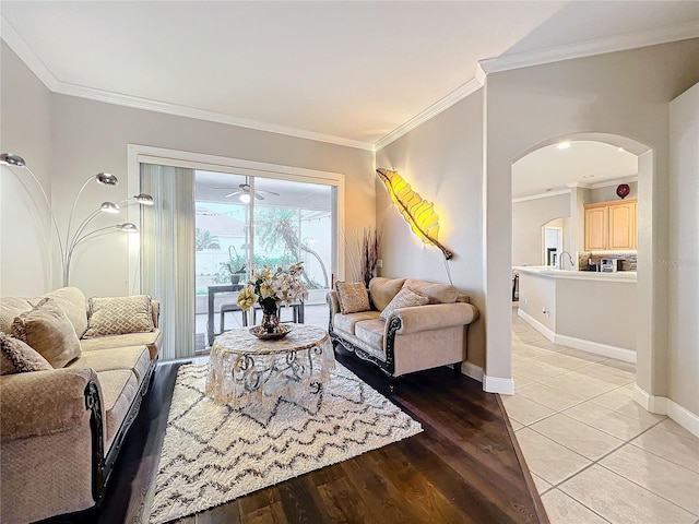 living room featuring crown molding and light wood-type flooring