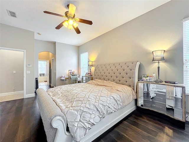 bedroom with ceiling fan and dark hardwood / wood-style floors