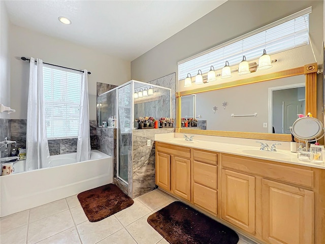 bathroom with tile patterned flooring, vanity, and independent shower and bath