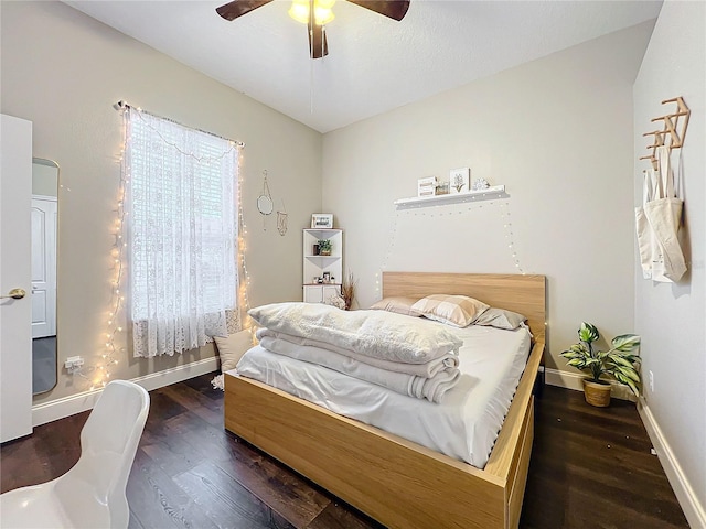 bedroom featuring dark wood-type flooring and ceiling fan