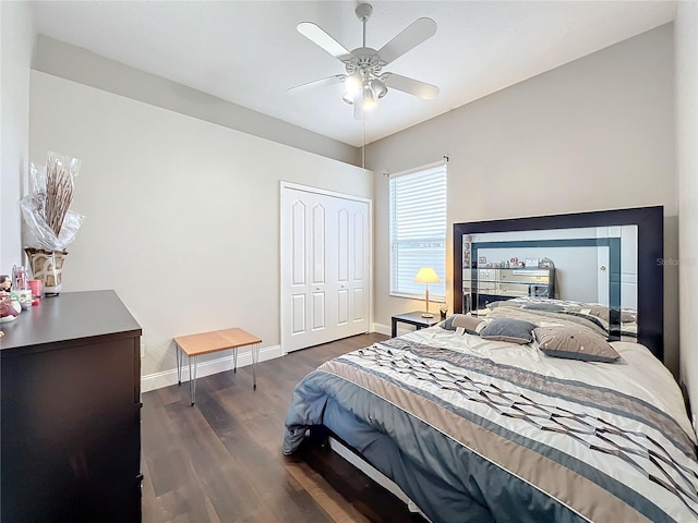 bedroom with dark hardwood / wood-style floors, a closet, and ceiling fan