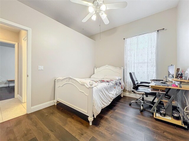 bedroom featuring dark wood-type flooring and ceiling fan