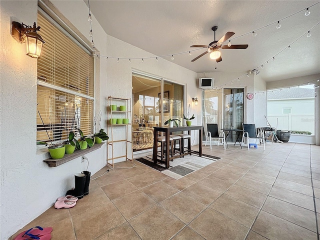 view of patio featuring ceiling fan