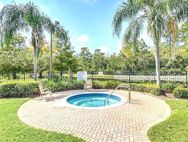 view of pool featuring a community hot tub and a patio