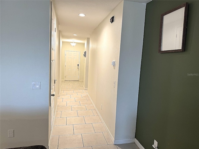 hallway with light tile patterned floors