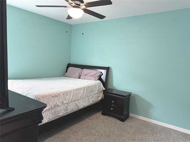 bedroom with light colored carpet and ceiling fan