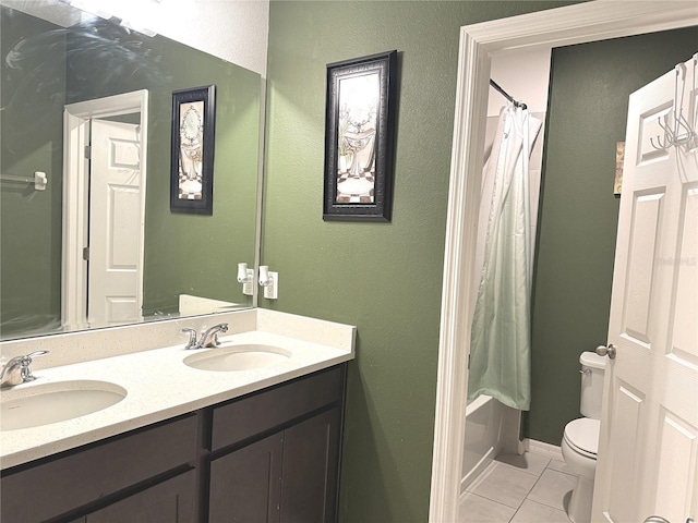 full bathroom featuring shower / tub combo with curtain, vanity, tile patterned floors, and toilet