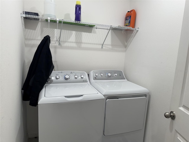 laundry room with washer and clothes dryer