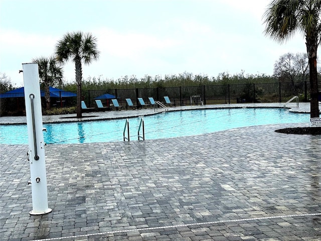 view of pool featuring a patio area