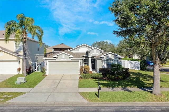 view of front facade featuring a garage and a front yard