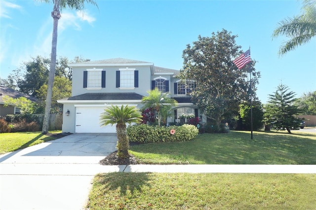 view of property featuring a garage and a front yard