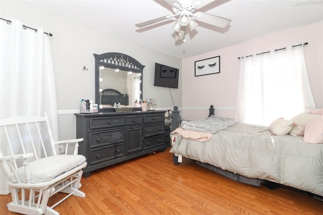 bedroom featuring ceiling fan and hardwood / wood-style flooring