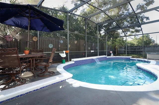 view of swimming pool featuring a patio area, a lanai, and pool water feature