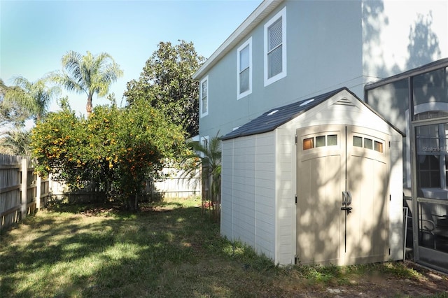 view of outdoor structure with a lawn