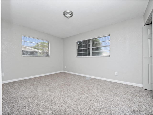 empty room with carpet flooring