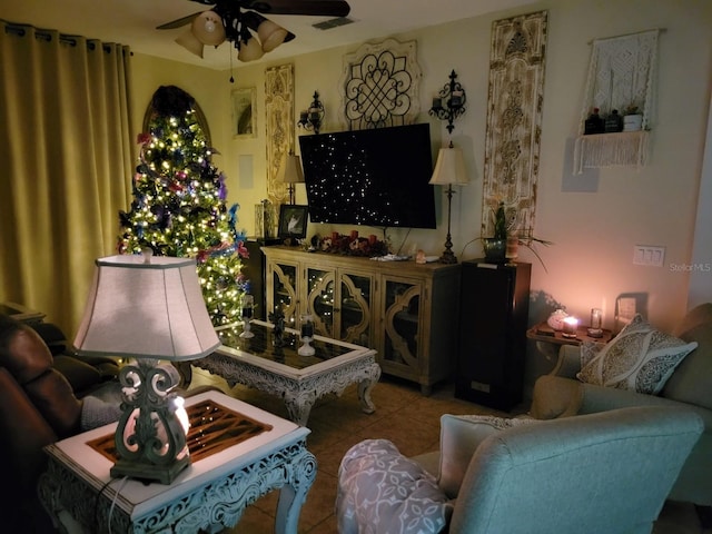 tiled living room with ceiling fan