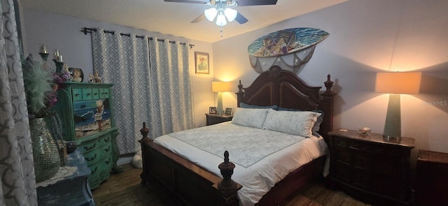 bedroom with ceiling fan and dark hardwood / wood-style flooring