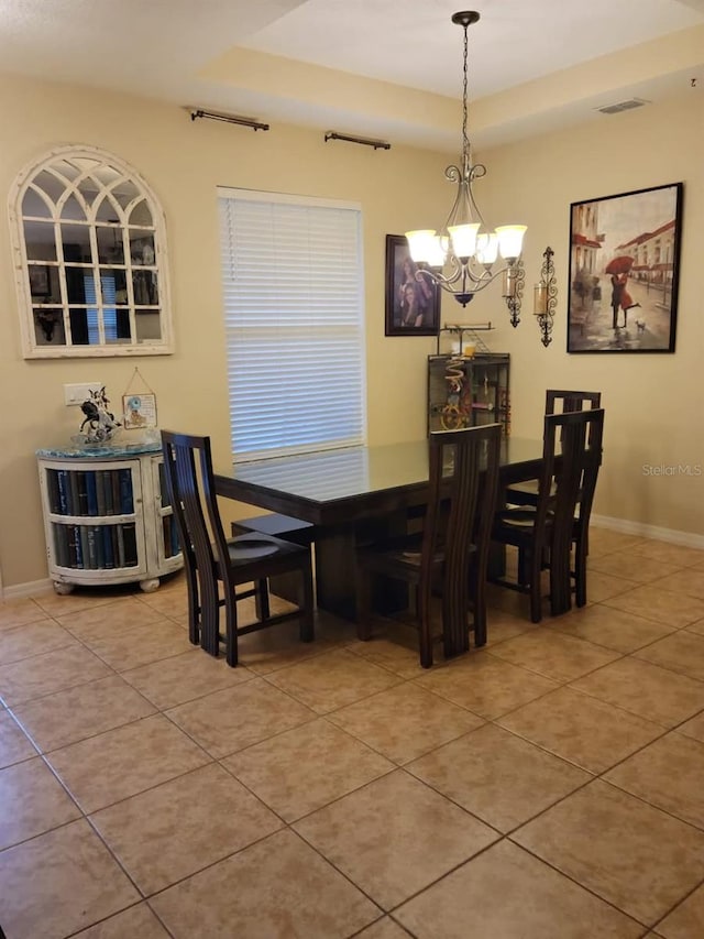 dining room with an inviting chandelier and tile patterned floors