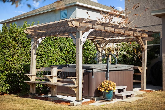 exterior space with a pergola and a hot tub