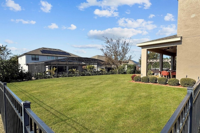 view of yard featuring glass enclosure