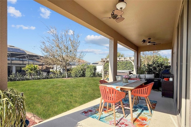 view of patio featuring ceiling fan