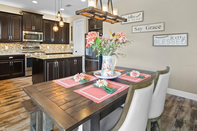 dining room with dark wood-type flooring