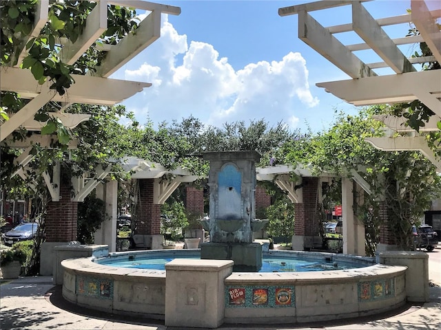 view of swimming pool featuring a pergola