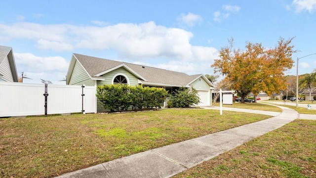 view of front facade featuring a garage and a front lawn