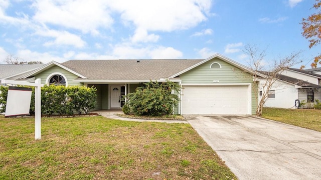 single story home with a front yard and a garage