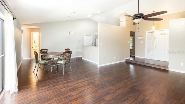 dining room with vaulted ceiling, dark wood-type flooring, and ceiling fan