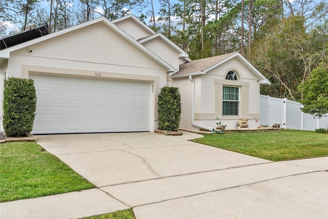 view of front of house with a garage and a front yard