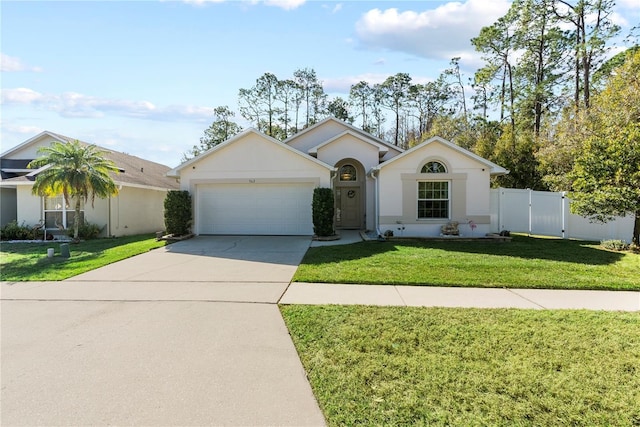 ranch-style house featuring a front yard and a garage