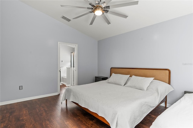 bedroom featuring vaulted ceiling, ceiling fan, connected bathroom, and dark hardwood / wood-style floors