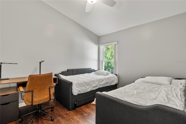 bedroom with ceiling fan, lofted ceiling, and dark hardwood / wood-style floors