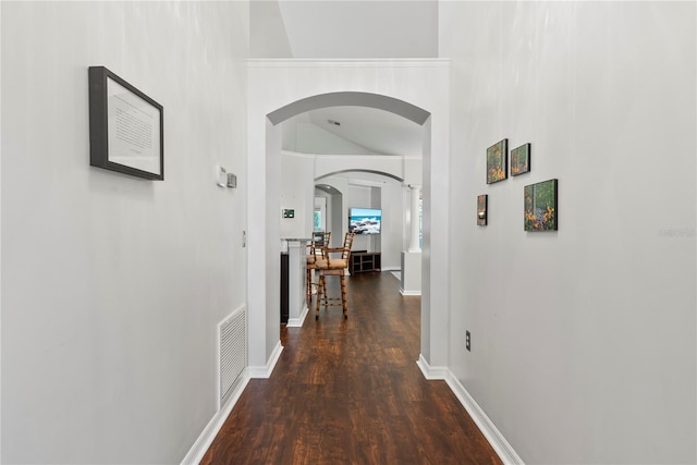 corridor featuring dark wood-type flooring