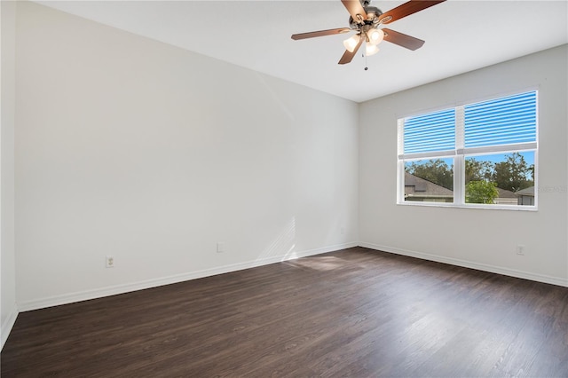 unfurnished room featuring ceiling fan and dark hardwood / wood-style floors