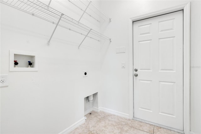 washroom featuring hookup for an electric dryer, hookup for a washing machine, and light tile patterned flooring