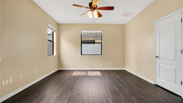 spare room featuring dark hardwood / wood-style floors and ceiling fan