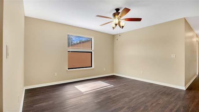 empty room featuring ceiling fan and dark wood-type flooring