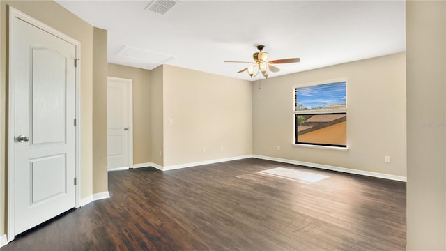 empty room with dark hardwood / wood-style floors and ceiling fan