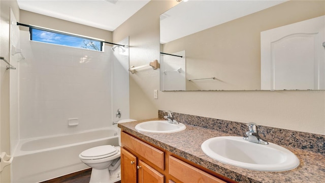 full bathroom featuring tub / shower combination, toilet, and vanity