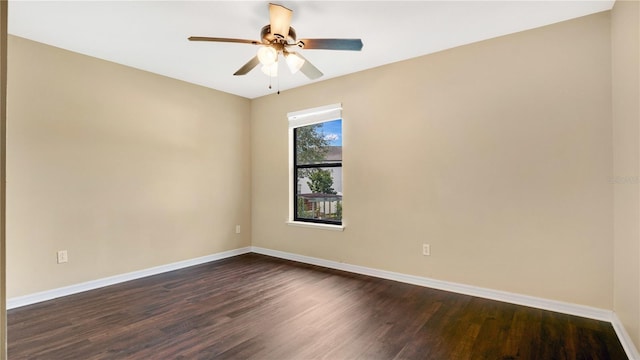 unfurnished room with ceiling fan and dark hardwood / wood-style flooring