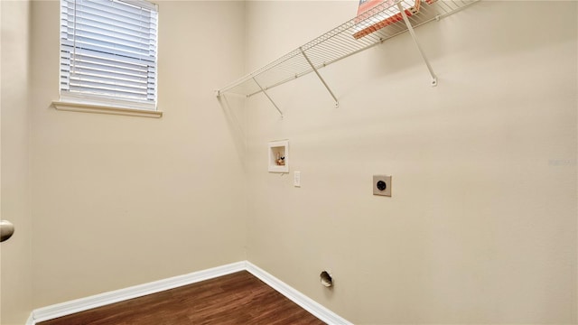 washroom with hookup for an electric dryer, hardwood / wood-style floors, and washer hookup