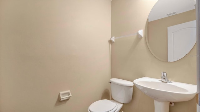 bathroom featuring sink and toilet